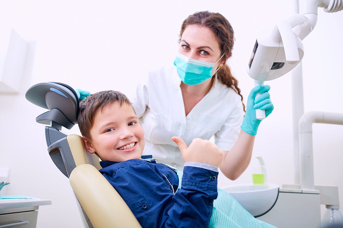 Kid with the dentist